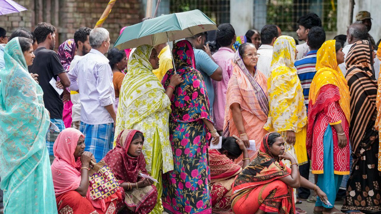 Voters wait in queues to cast thir votes at a polling station during a repoll ordered by the Election Commission following reports of electoral malpractices. Pic/PTI